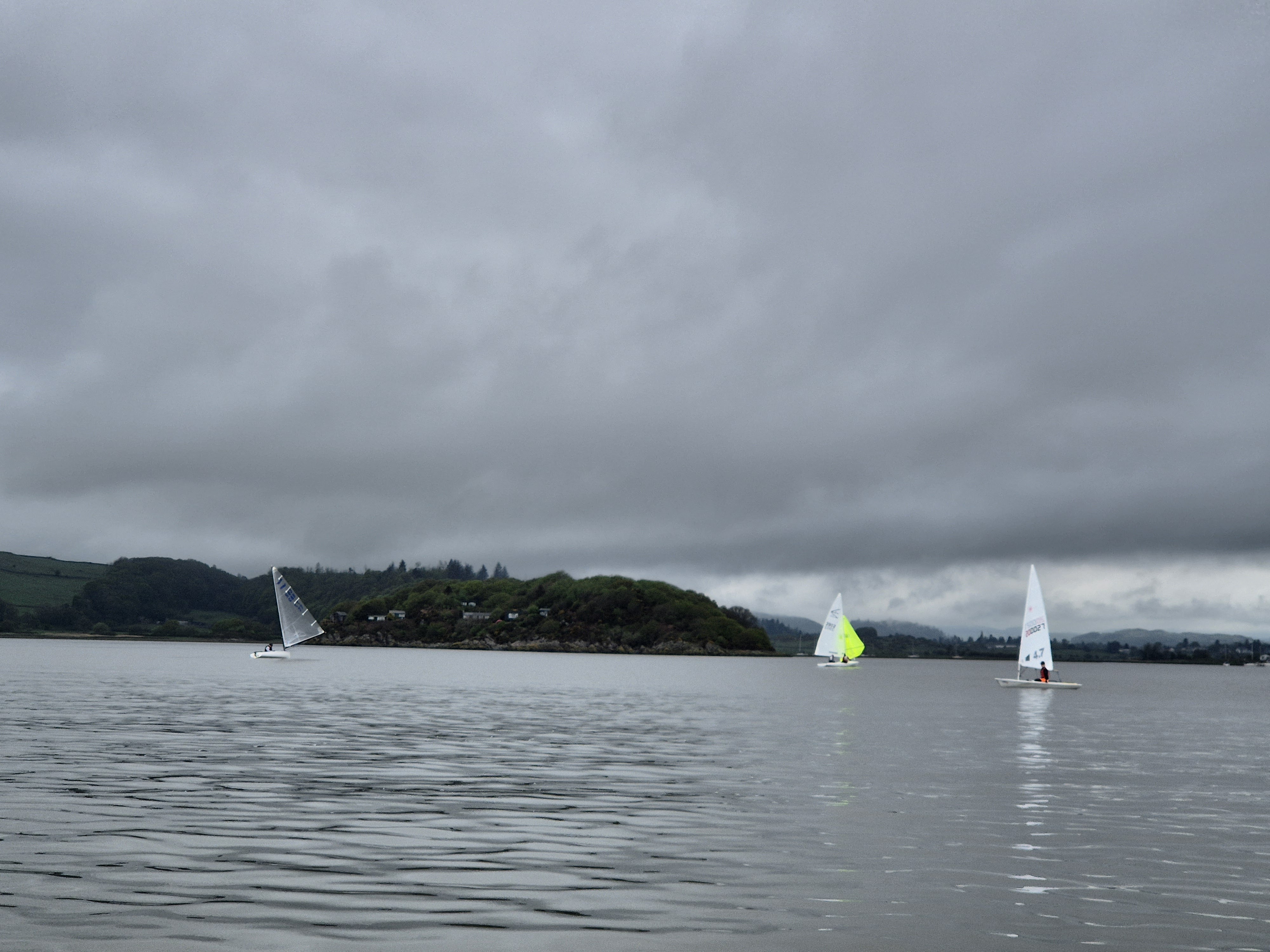 Stewart Mitchell in the Finn chasing Colin and Jamie in the F15 (yellow Spinaker) and Toby Inglehart in the Laser 4.7