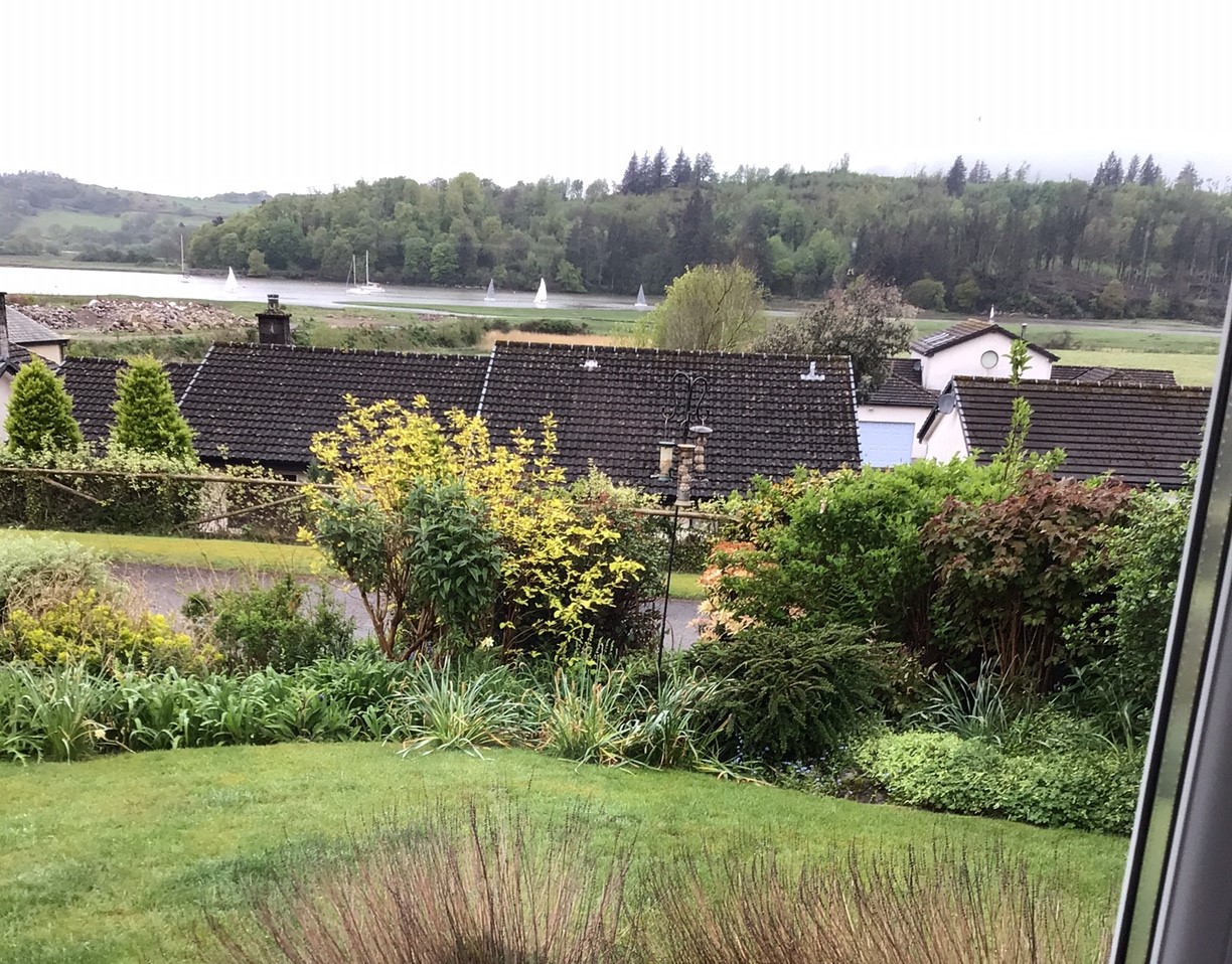 Residents in Merse Way get grandstand view with several competitors arriving downstream among moored yachts
